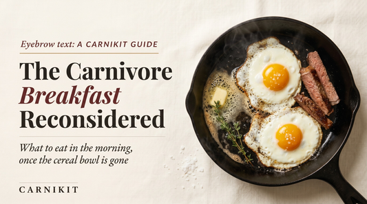 Editorial overhead photograph of two eggs frying in foaming butter in a black cast-iron skillet, with a few slices of cooked steak.