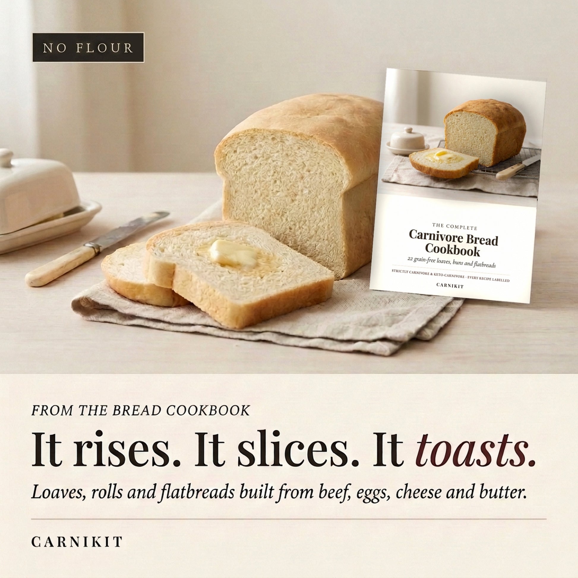 A loaf of bread and two slices with butter are arranged on a table beside a cookbook titled 'The Carnivore Bread Cookbook' by Carnikit. The scene is styled like a warm kitchen setting, with a butter dish and knife in the background.