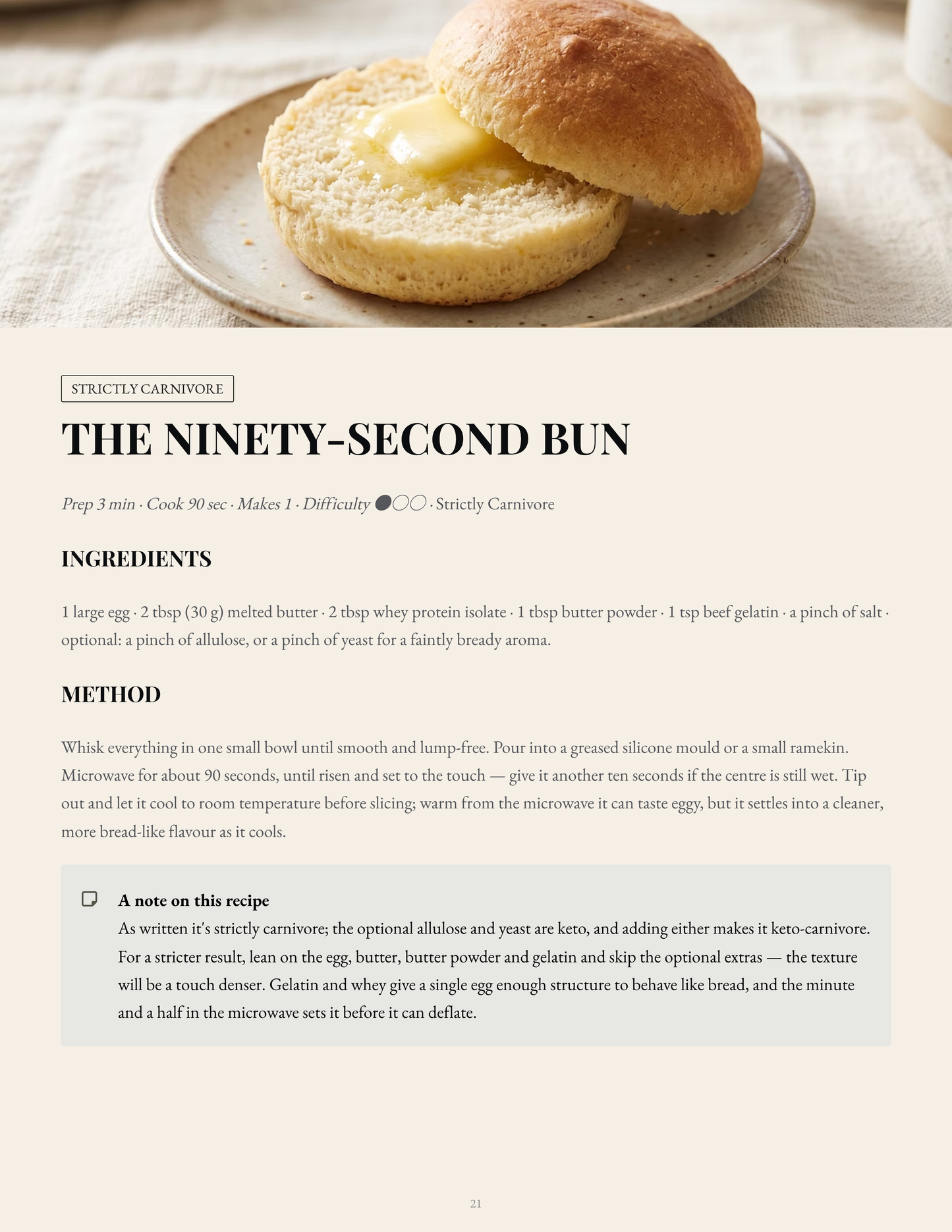 A recipe card for 'The Ninety-Second Bun' from Strictly carnivore, showing a photo of a golden-brown baked bun on a plate at the top and detailed preparation instructions below on a cream background.