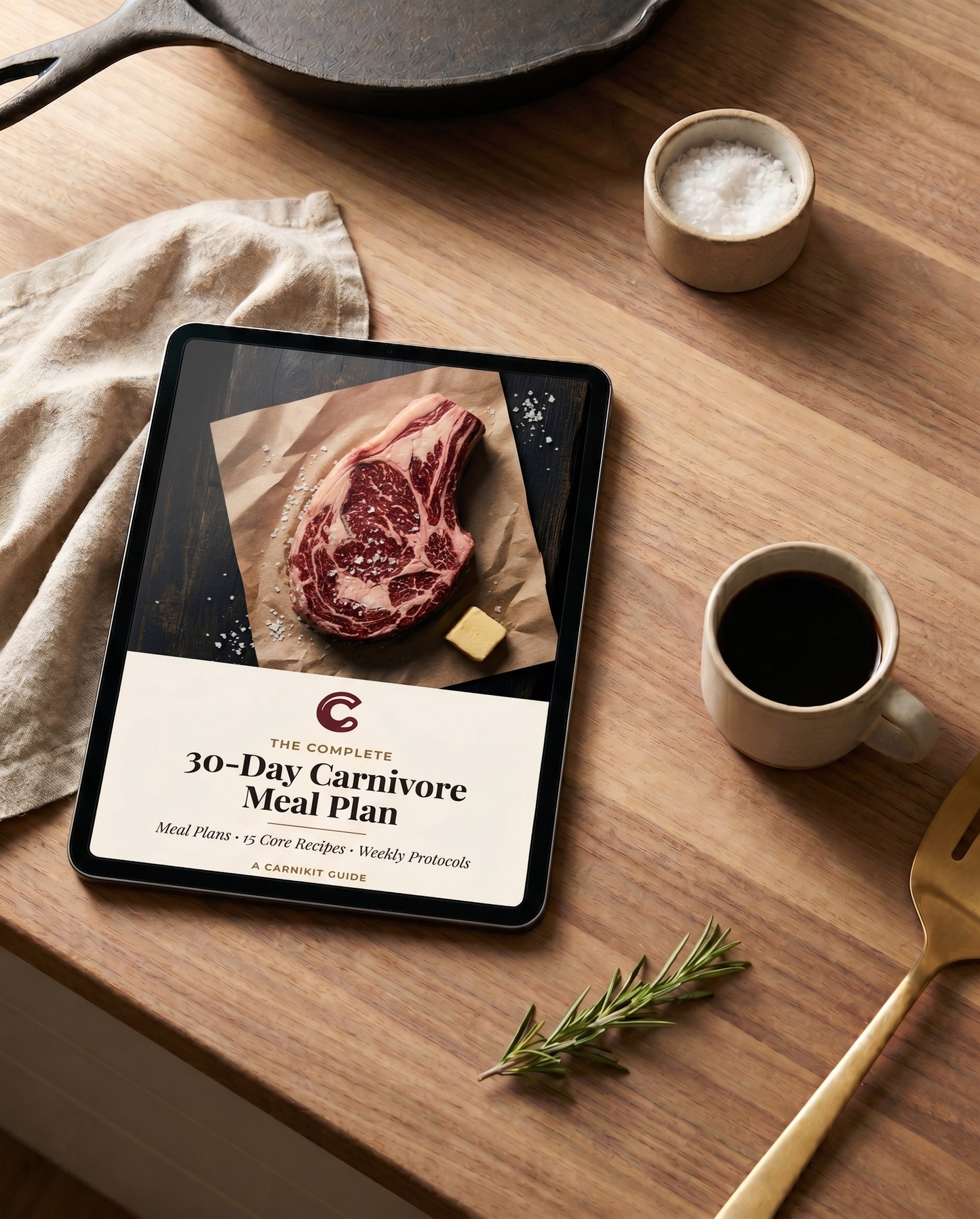 Tablet displaying a 30-Day Carnivore Meal Plan on a wooden table with a steak image.